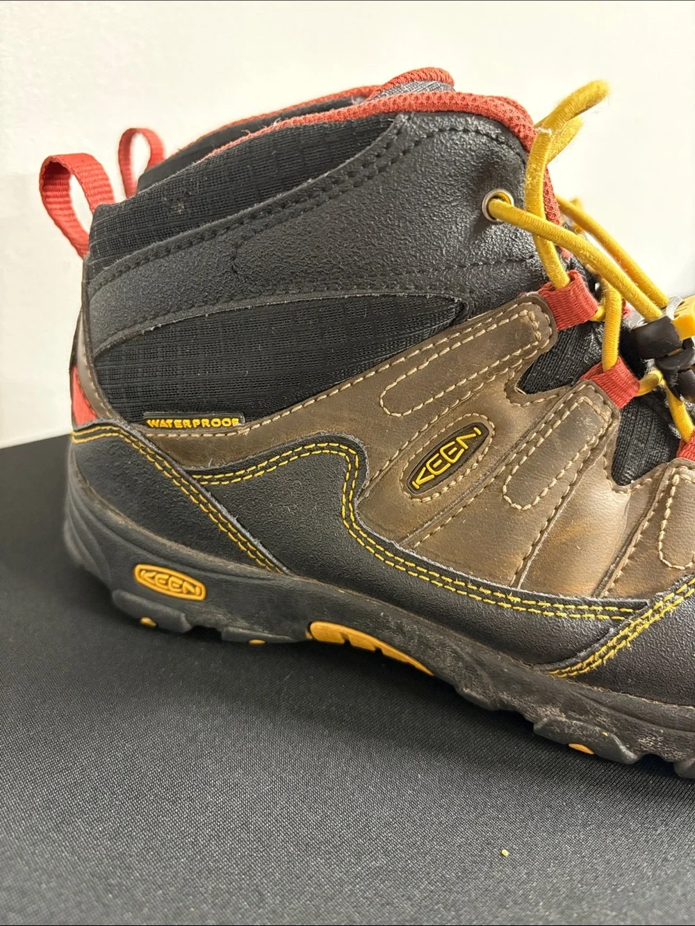 KEEN Kids Brown Hiking Boots with Yellow Laces and Red Trim